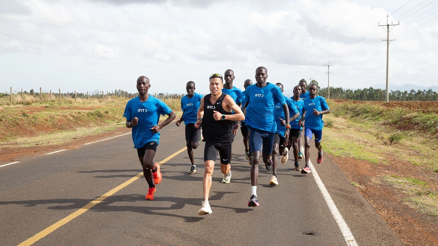 iFIT trainer Luis Orta runs with local athletes during the Kenya Run Camp series, a guided endurance training program available on the iFIT platform.